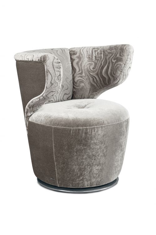 Für «Croissant» dienten Stilelemente aus dem Art Dèco und dem Space Age als Inspirationsquelle. Das überaus bequeme Sitzmöbel gibt es auch als Sofa in einfarbig schlicht, knallig oder zweifarbig bunt. Bretz.